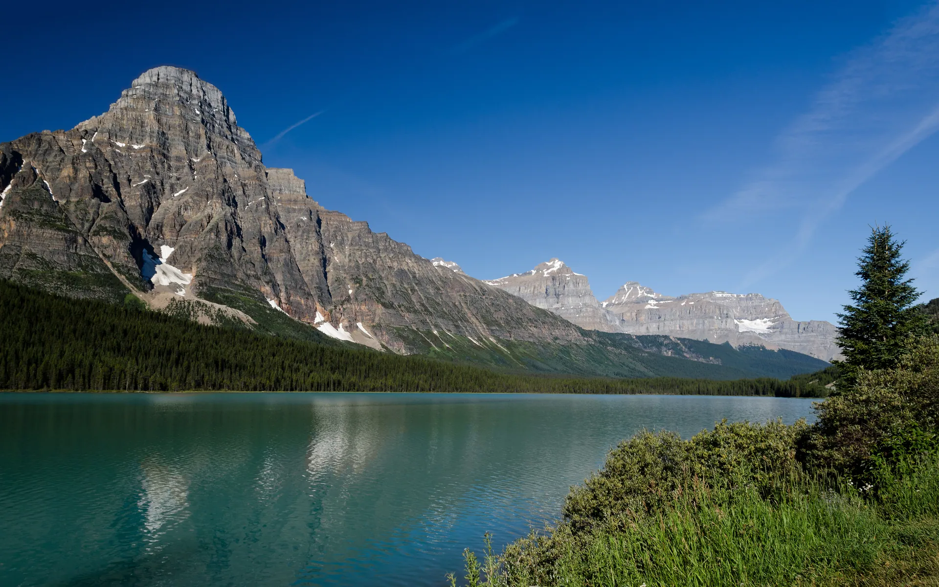 Mount Chephren and the Waterfowl Lakes reflected in calm turquoise water