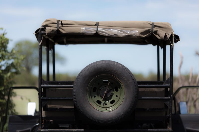 The back of a safari four-wheel drive with a spare wheel